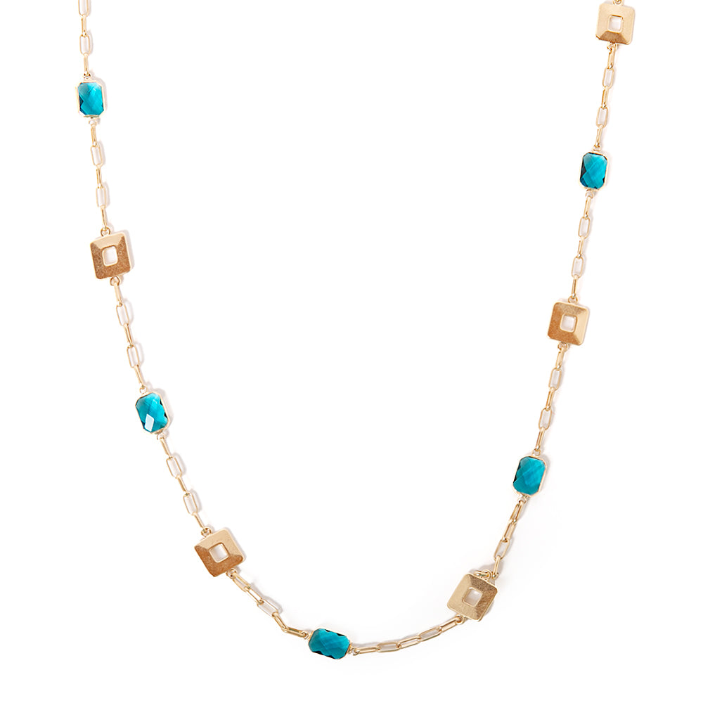 Casey necklace in gold with turquoise blue pendants and square metal pendants spread across the chain